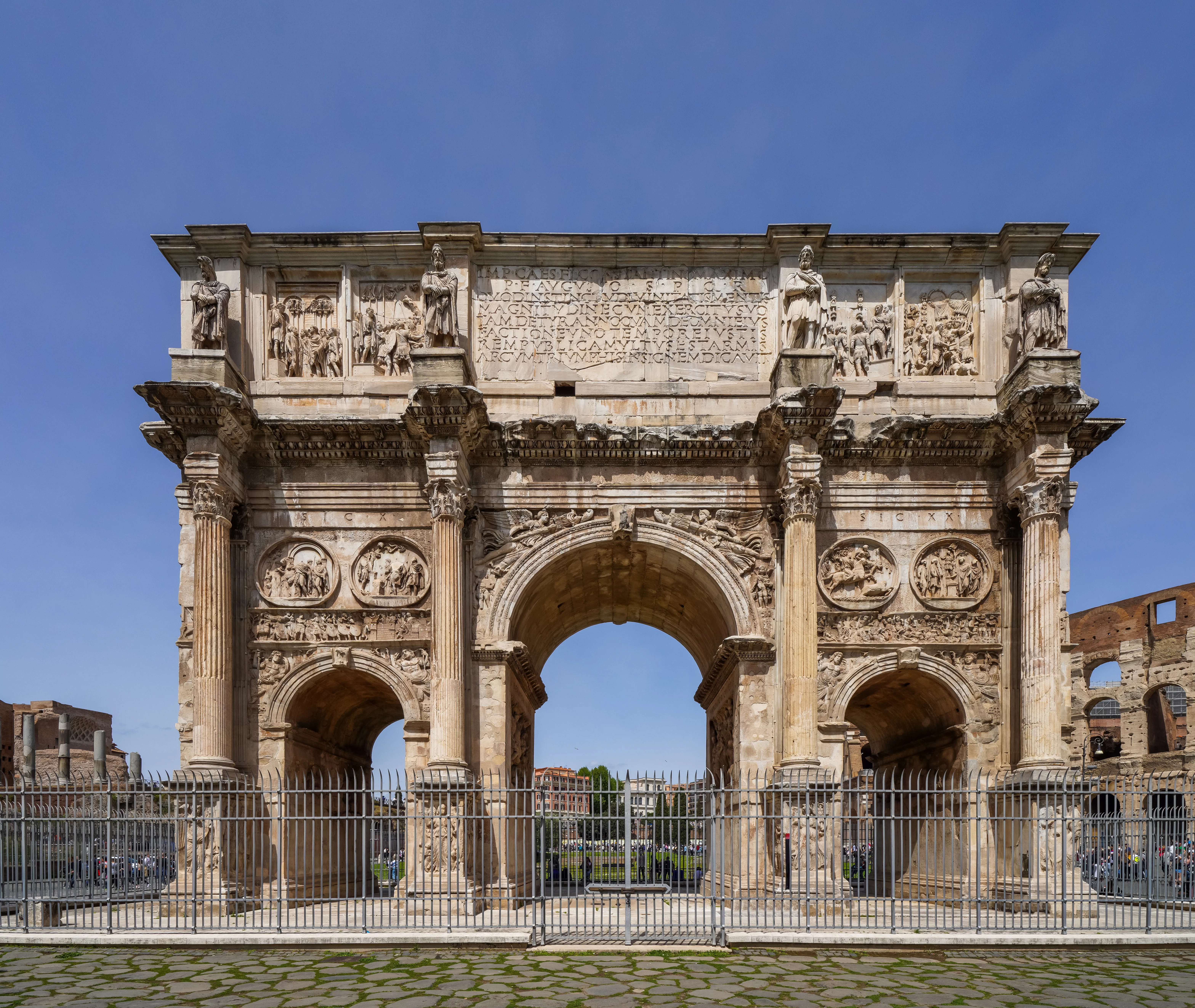The Arch of Constantine with the Colosseum visible in the background